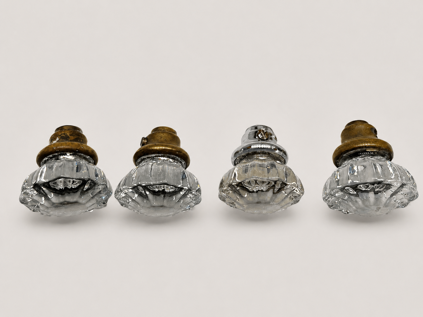 Four vintage glass door knobs with metal collars for replacement door hardware